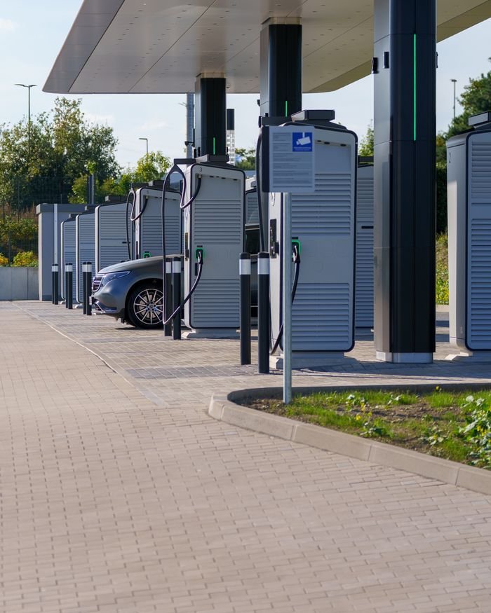 Contemporary outdoor electric vehicle charging station with sleek design and innovative technology for clean energy.