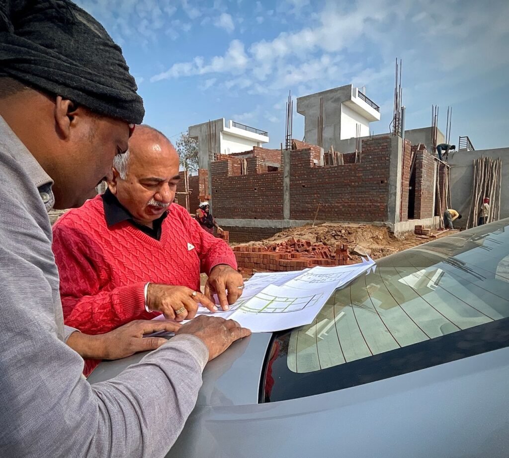 pexels-photo-24525165-24525165-1 Team of architects examining building plans outdoors at a construction site.