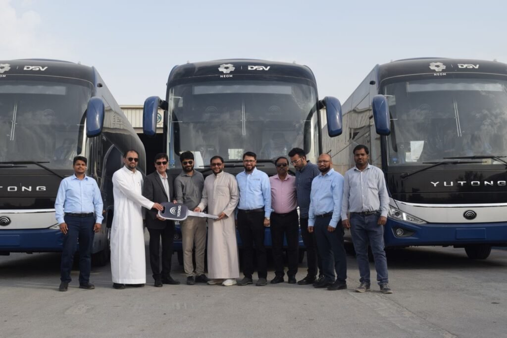 pexels-photo-31745194-31745194 Group of businessmen posing in front of new Yutong buses for a handover ceremony.