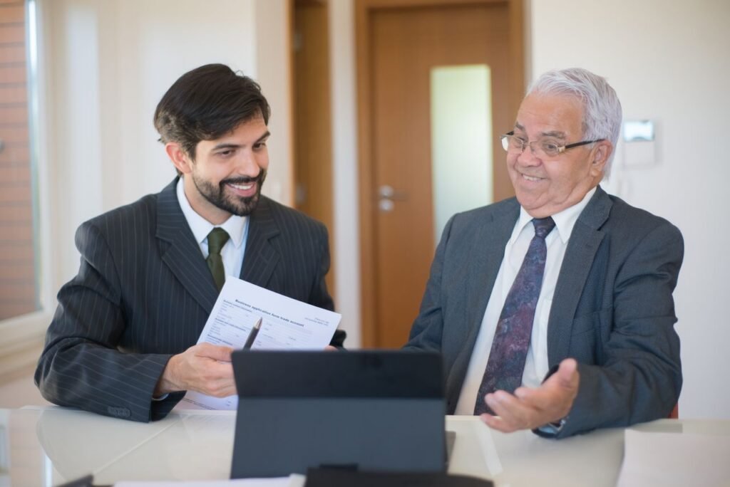 pexels-photo-8815880-8815880 Two businessmen discussing a real estate deal in a modern office setting.